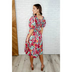 Turn heads in the Delightful Blooms Puff Sleeve Floral Midi Dress. A vibrant flattering plus size dress perfect