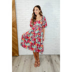 Turn heads in the Delightful Blooms Puff Sleeve Floral Midi Dress. A vibrant flattering plus size dress perfect