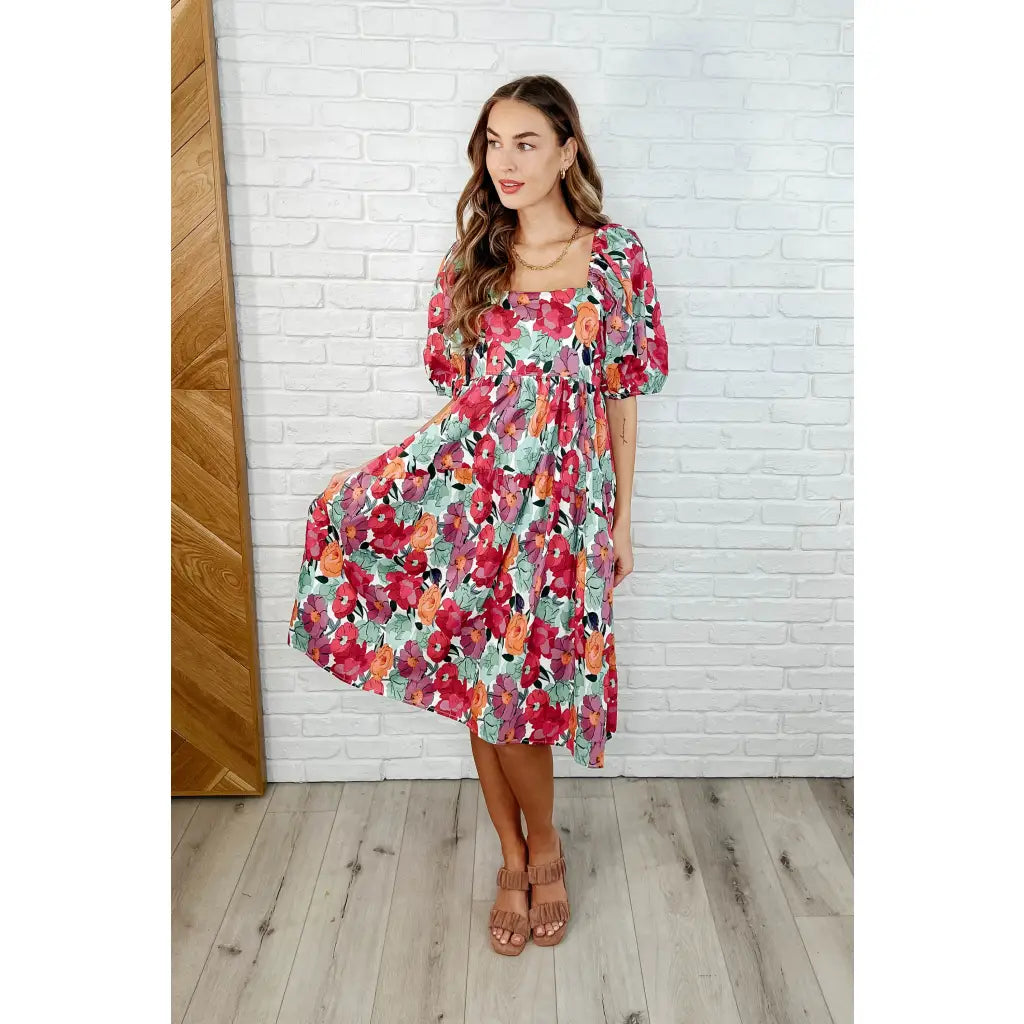 Turn heads in the Delightful Blooms Puff Sleeve Floral Midi Dress. A vibrant flattering plus size dress perfect