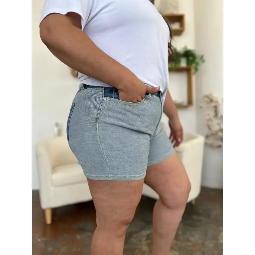 Two-tone Judy Blue denim shorts with color block detail and curve-hugging stretch. Plus size friendly perfect for bold