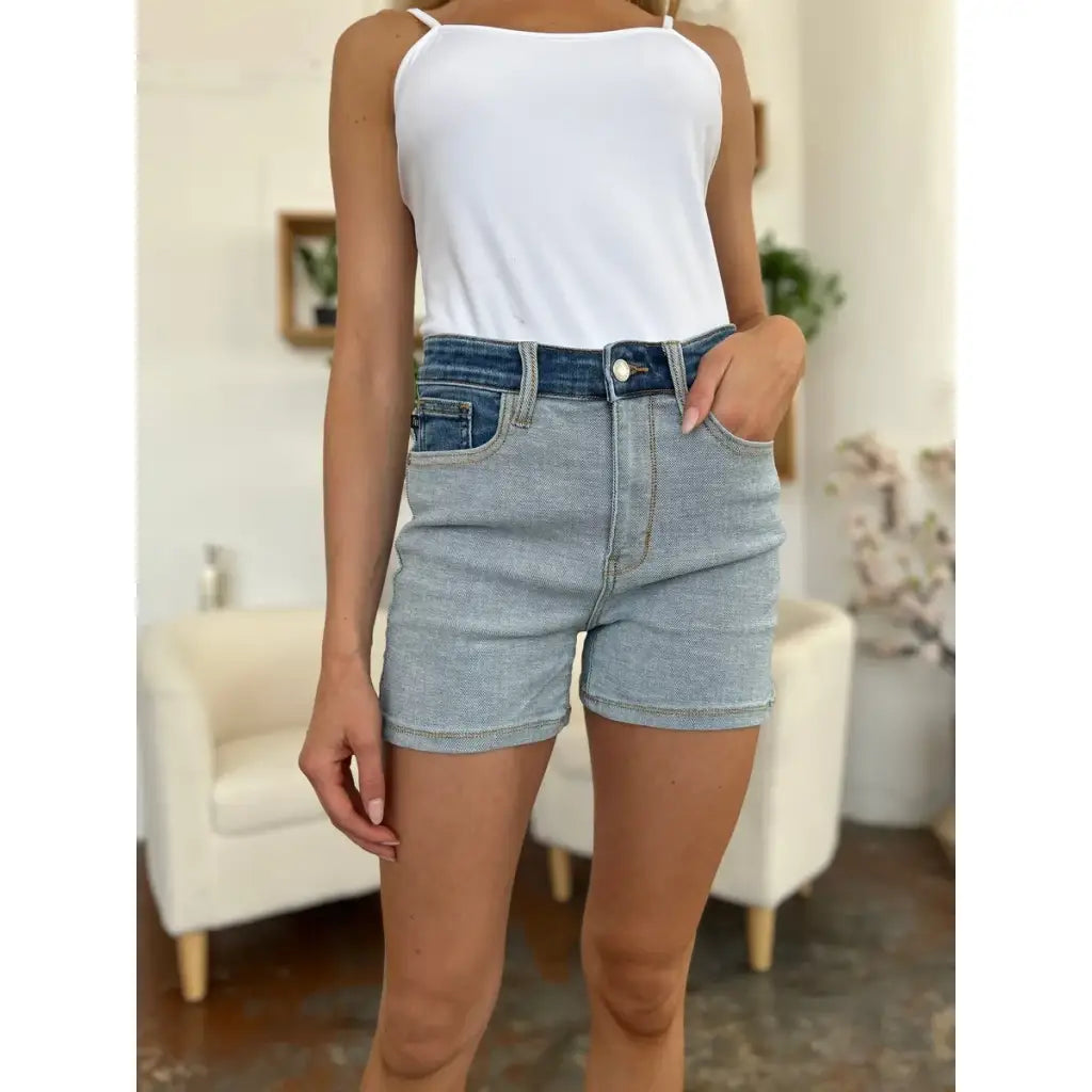 Two-tone Judy Blue denim shorts with color block detail and curve-hugging stretch. Plus size friendly perfect for bold