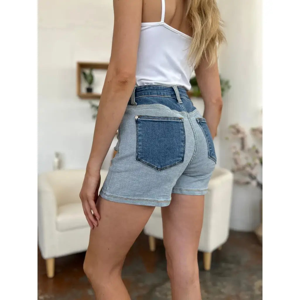 Two-tone Judy Blue denim shorts with color block detail and curve-hugging stretch. Plus size friendly perfect for bold