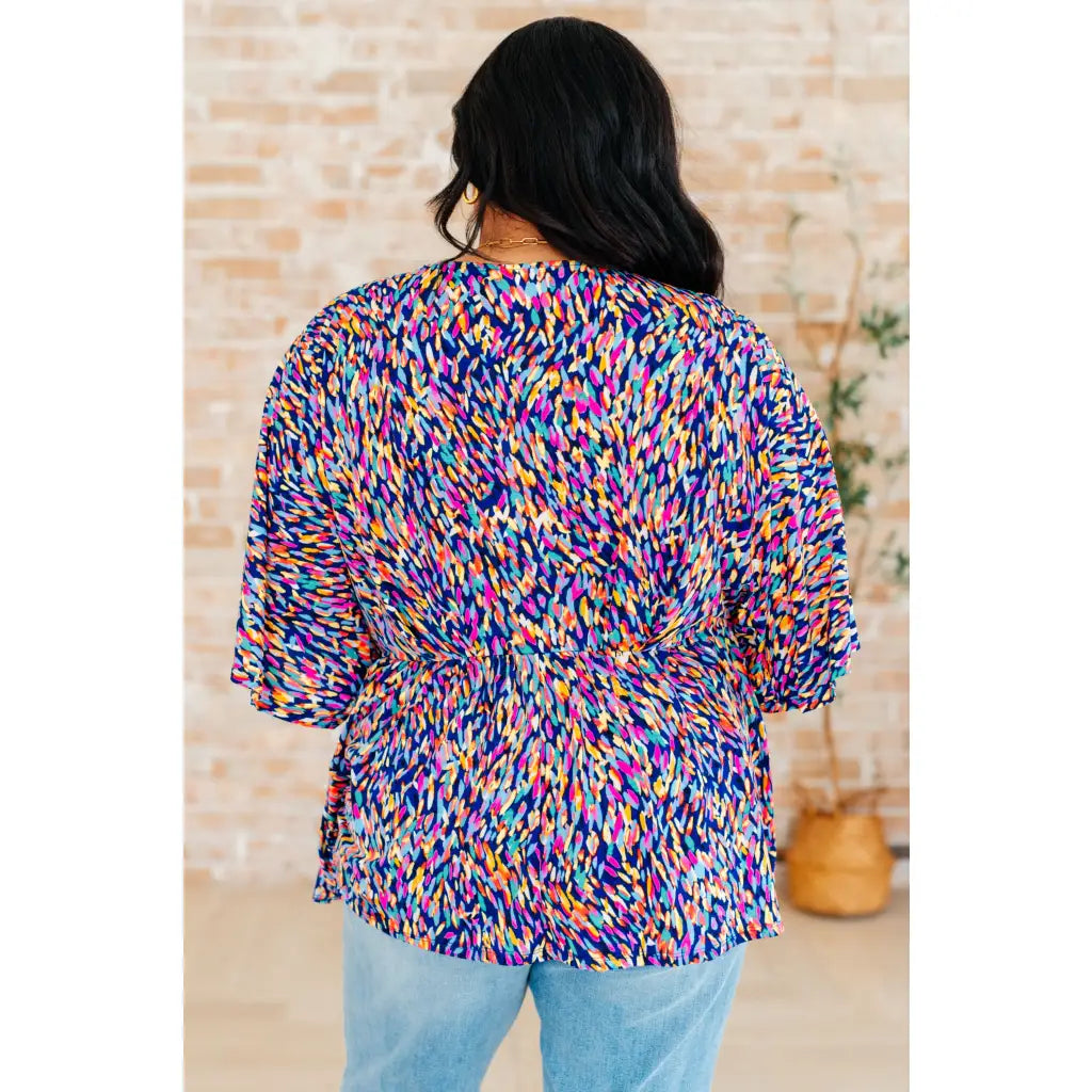 Unleash your inner dreamer with our Dreamer Peplum Top in Painted Royal! Featuring a playful v - neckline flowy dolman