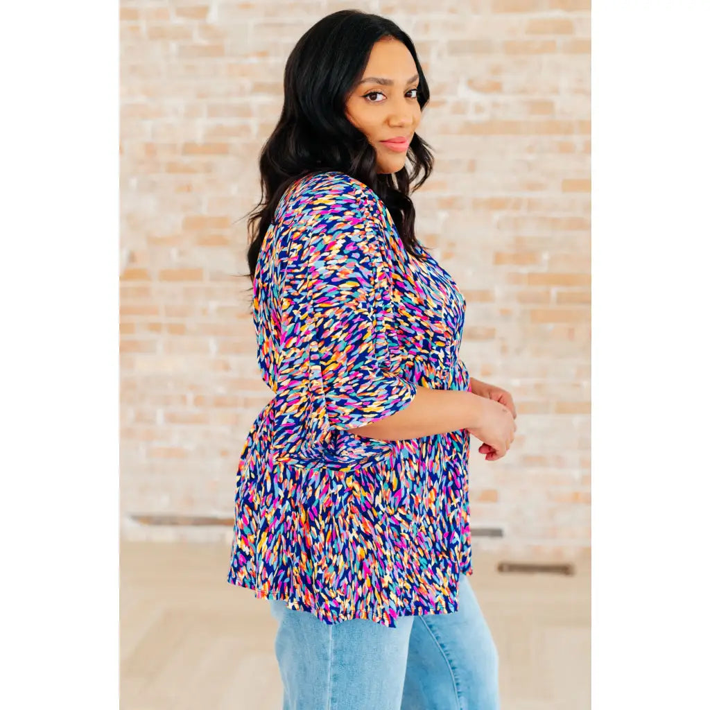 Unleash your inner dreamer with our Dreamer Peplum Top in Painted Royal! Featuring a playful v - neckline flowy dolman