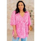Step out in our Dreamer Peplum Top Pink Leopard! Featuring a playful v - neckline flowy dolman sleeves and flattering