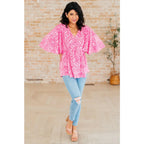 Step out in our Dreamer Peplum Top Pink Leopard! Featuring a playful v - neckline flowy dolman sleeves and flattering