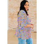 Unleash your inner dreamer with our Dreamer Peplum Top in Purple Retro Ditsy Floral! Featuring a playful v-neckline