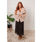 Our Dreaming in Blush Faux Fur Coat will make you shine on the dance floor or out town! Its shaggy faux lambs fur