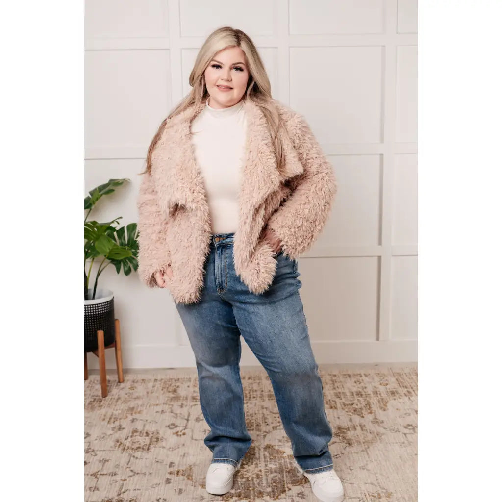 Our Dreaming in Blush Faux Fur Coat will make you shine on the dance floor or out town! Its shaggy faux lambs fur