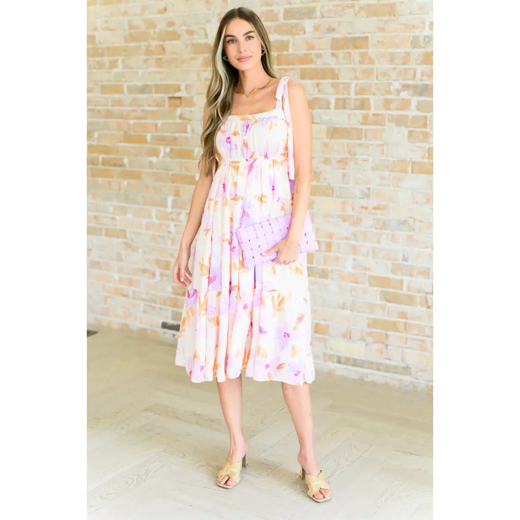 Turn heads in this dreamy floral print midi dress—adjustable straps flattering fit plus size friendly. A boutique