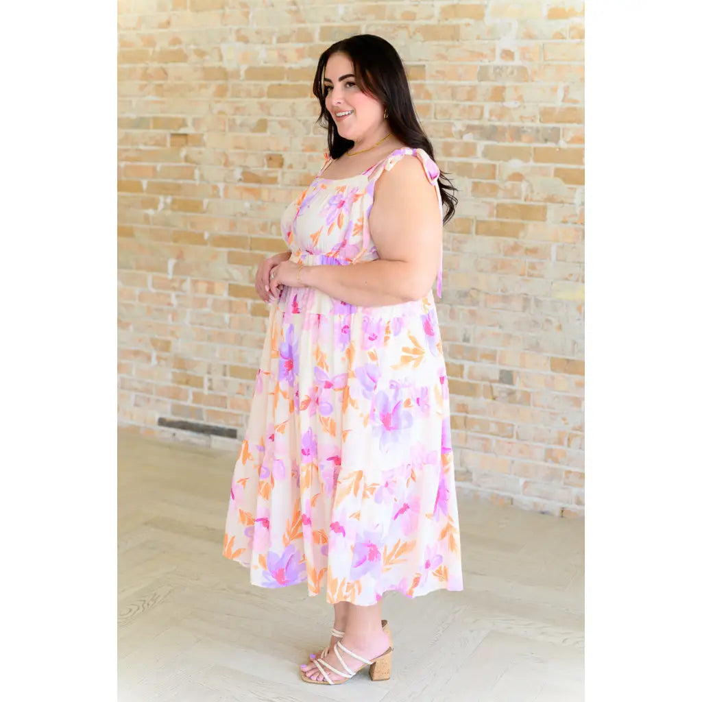 Turn heads in this dreamy floral print midi dress—adjustable straps flattering fit plus size friendly. A boutique