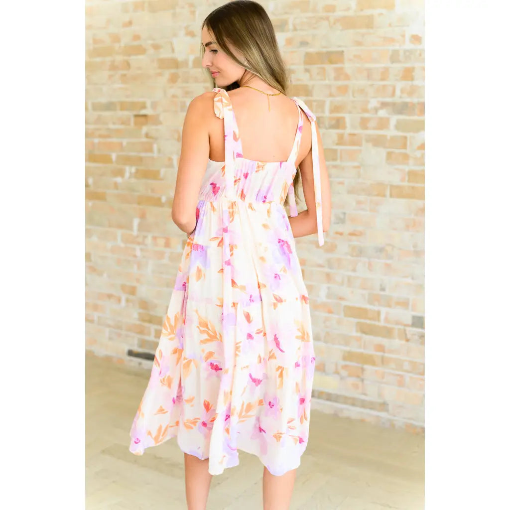 Turn heads in this dreamy floral print midi dress—adjustable straps flattering fit plus size friendly. A boutique