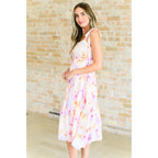 Turn heads in this dreamy floral print midi dress—adjustable straps flattering fit plus size friendly. A boutique