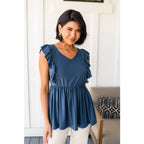 Our Dusty Blue Ruffled Babydoll Top is the perfect addition to your wardrobe! Crafted from a soft and stretchy jersey