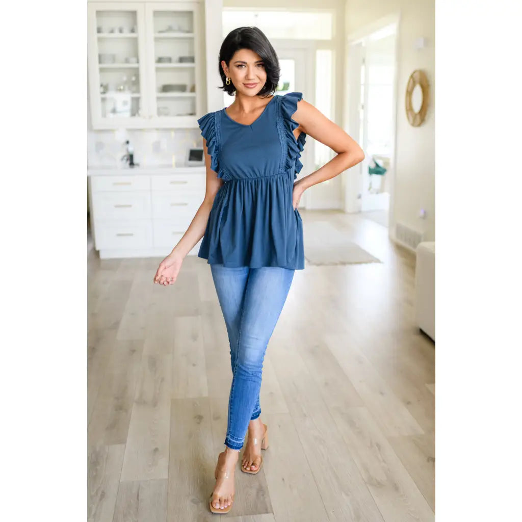 Our Dusty Blue Ruffled Babydoll Top is the perfect addition to your wardrobe! Crafted from a soft and stretchy jersey