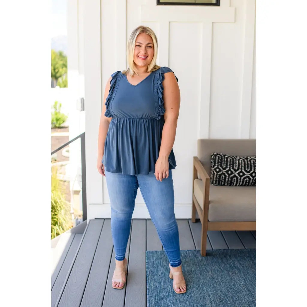 Our Dusty Blue Ruffled Babydoll Top is the perfect addition to your wardrobe! Crafted from a soft and stretchy jersey