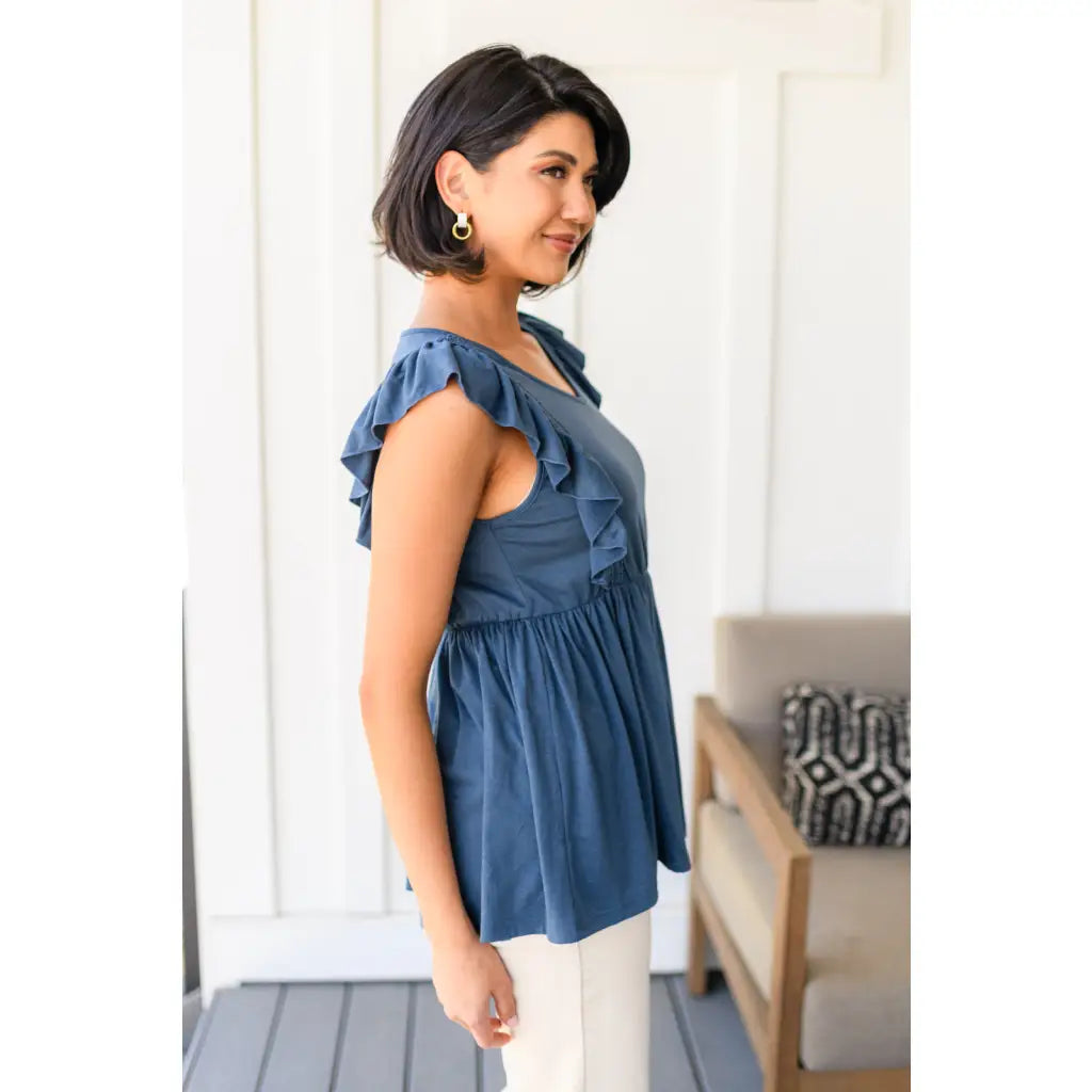 Our Dusty Blue Ruffled Babydoll Top is the perfect addition to your wardrobe! Crafted from a soft and stretchy jersey