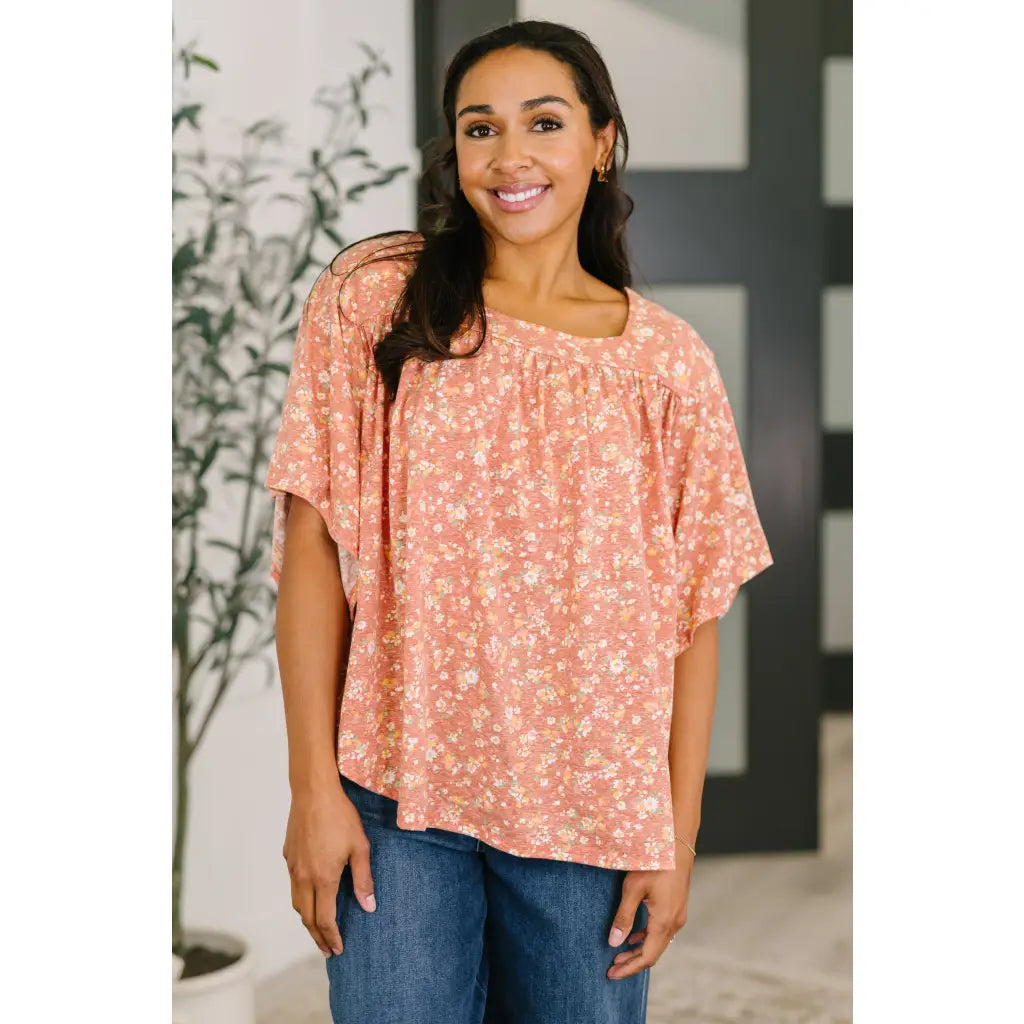 Shop this dusty rose floral top with flowy fit and stretch comfort. Available in standard plus sizes