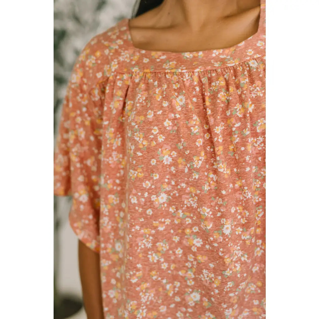 Shop this dusty rose floral top with flowy fit and stretch comfort. Available in standard plus sizes