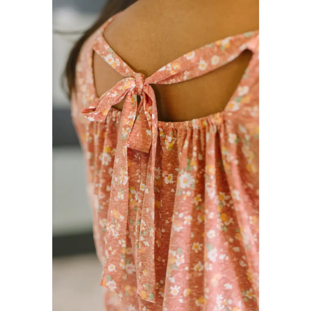 Shop this dusty rose floral top with flowy fit and stretch comfort. Available in standard plus sizes