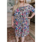 Bold off-shoulder animal print shift dress knee-length and curve-friendly. Available in S to 3XL. Ships 2–3 days.