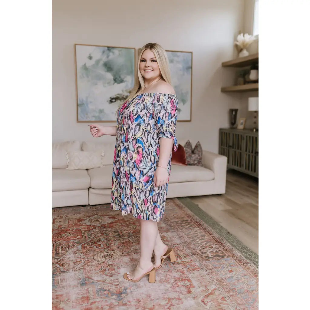 Bold off-shoulder animal print shift dress knee-length and curve-friendly. Available in S to 3XL. Ships 2–3 days.