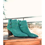 Make a statement with the Elsa Leather Ankle Boot in Teal! Genuine suede stylish hardware and cushioned comfort.