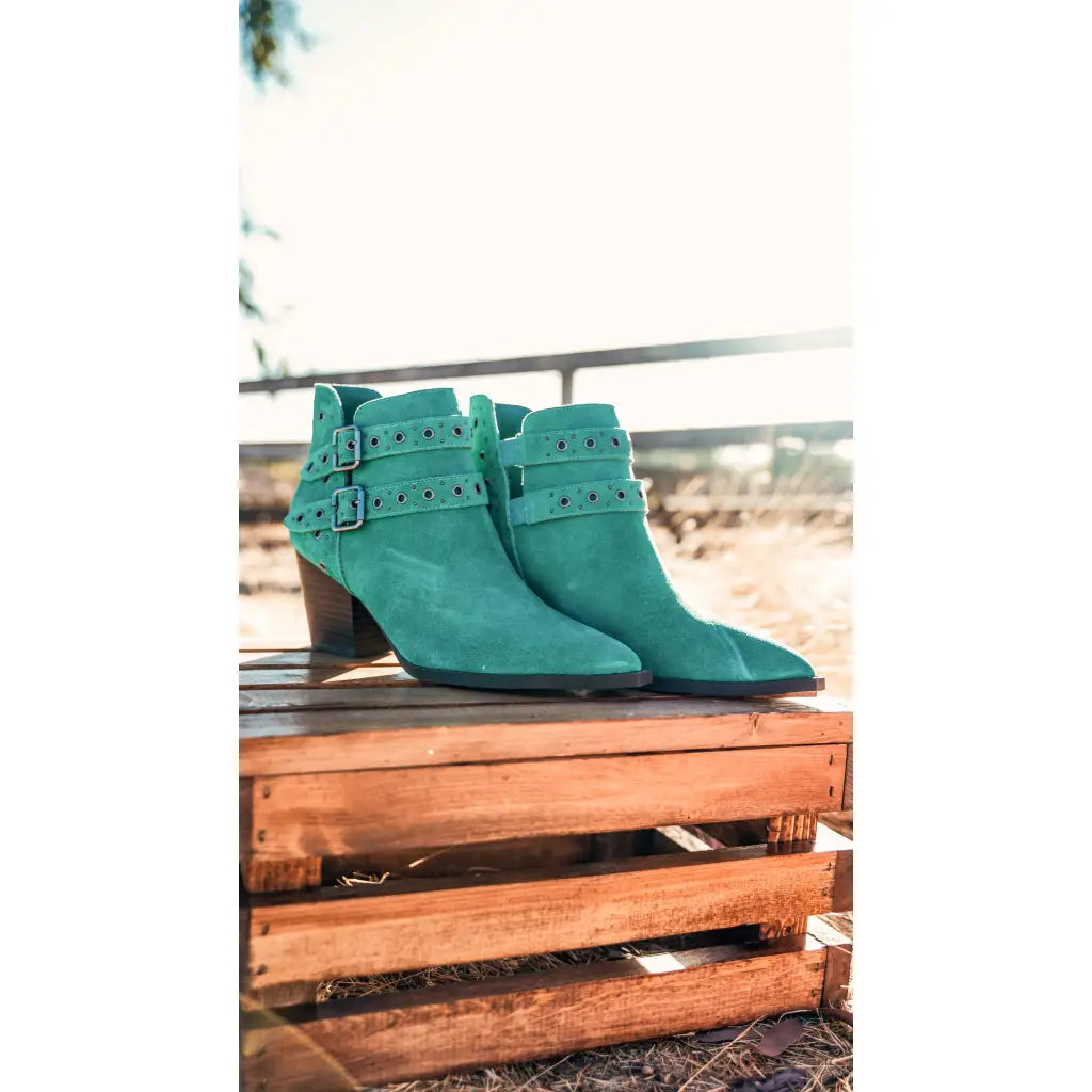 Make a statement with the Elsa Leather Ankle Boot in Teal! Genuine suede stylish hardware and cushioned comfort.