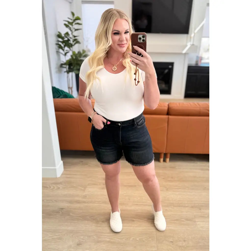Get ready for some frayed fun with our Ember High Rise Control Top Fray Hem Shorts from Judy Blue! The washed