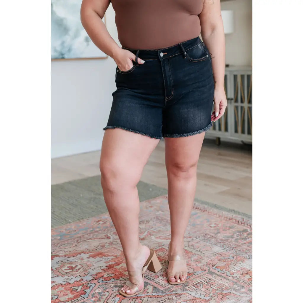 Get ready for some frayed fun with our Ember High Rise Control Top Fray Hem Shorts from Judy Blue! The washed