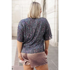 This beautiful Evening of Stars Sequin Top will shine all night with its jewel toned sequin mesh and relaxed fit.