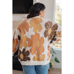 Our Exquisitely Fall Floral Cardigan is a retro mod floral oversized grandpa cardigan featuring an eye-catching large