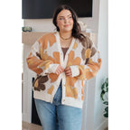 Our Exquisitely Fall Floral Cardigan is a retro mod floral oversized grandpa cardigan featuring an eye-catching large