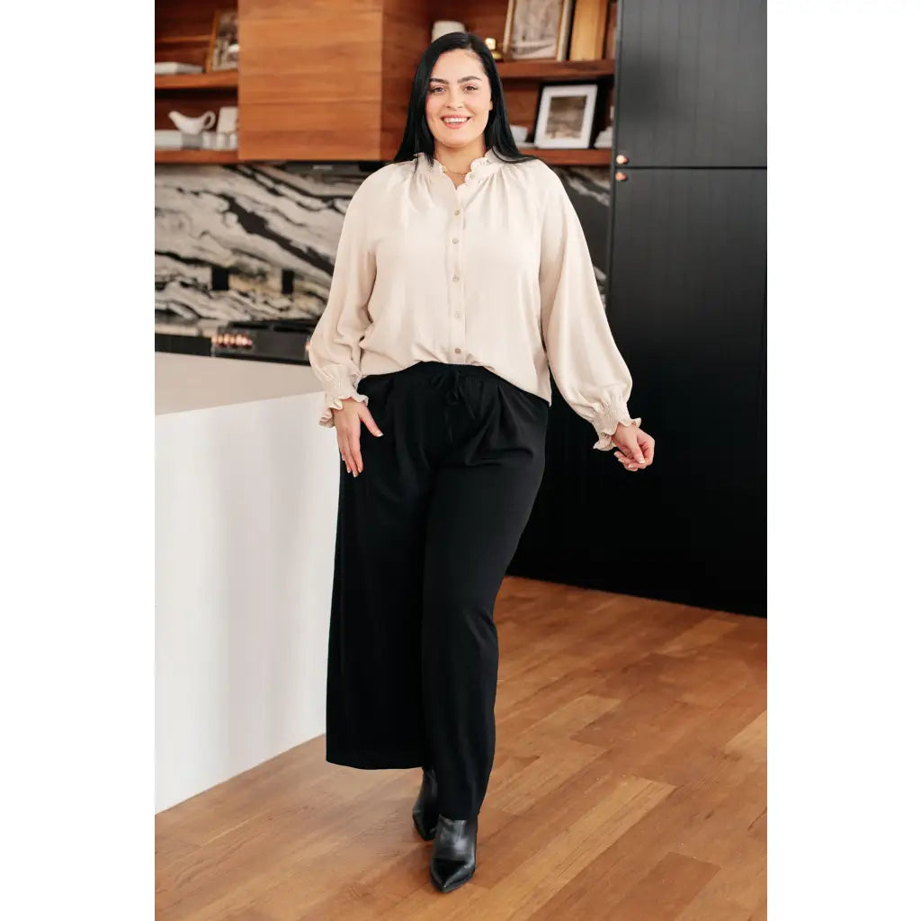 Chic cream button up top with ruffled neckline and relaxed fit. Plus size friendly perfect for layering tucking work