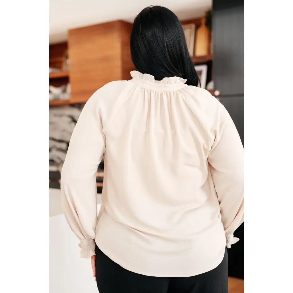Chic cream button up top with ruffled neckline and relaxed fit. Plus size friendly perfect for layering tucking work