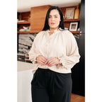 Chic cream button up top with ruffled neckline and relaxed fit. Plus size friendly perfect for layering tucking work