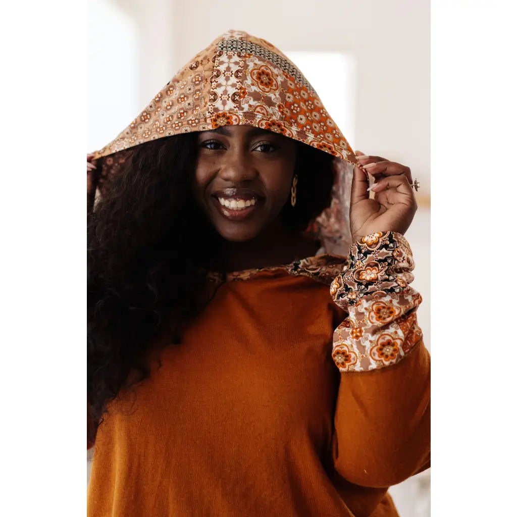 Our Fall Floral Mixed Print Hoodie features a rust colored brushed knit with patterned bulgari accents design.