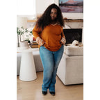 Our Fall Floral Mixed Print Hoodie features a rust colored brushed knit with patterned bulgari accents design.