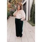 Introducing our new Feeling Good Velvet Blouse! This fashion must-have features puffed sleeves a buttoned sleeve cuff