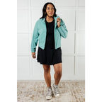 Keep your serve stylish with our Fit Happens Nylon Tennis Jacket in Teal. The high neckline and bubble gathered detail