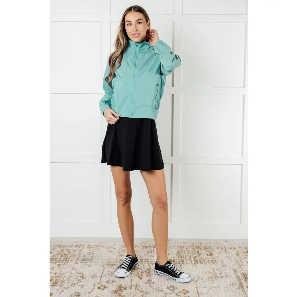 Keep your serve stylish with our Fit Happens Nylon Tennis Jacket in Teal. The high neckline and bubble gathered detail
