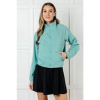 Keep your serve stylish with our Fit Happens Nylon Tennis Jacket in Teal. The high neckline and bubble gathered detail