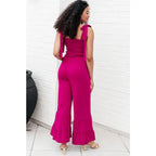 Our Flared and Ruffled Magenta Jumpsuit is perfect for every occasion. Crafted from thick stretchy jersey knit