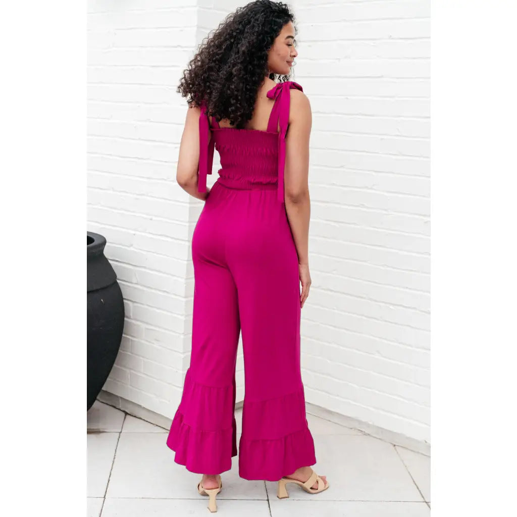 Our Flared and Ruffled Magenta Jumpsuit is perfect for every occasion. Crafted from thick stretchy jersey knit
