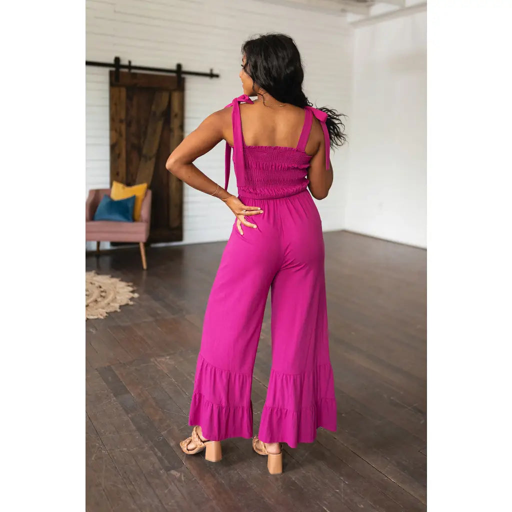 Our Flared and Ruffled Magenta Jumpsuit is perfect for every occasion. Crafted from thick stretchy jersey knit