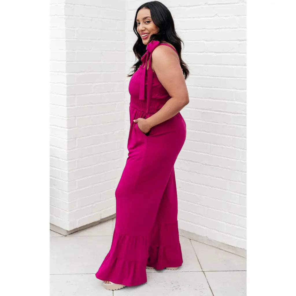 Our Flared and Ruffled Magenta Jumpsuit is perfect for every occasion. Crafted from thick stretchy jersey knit