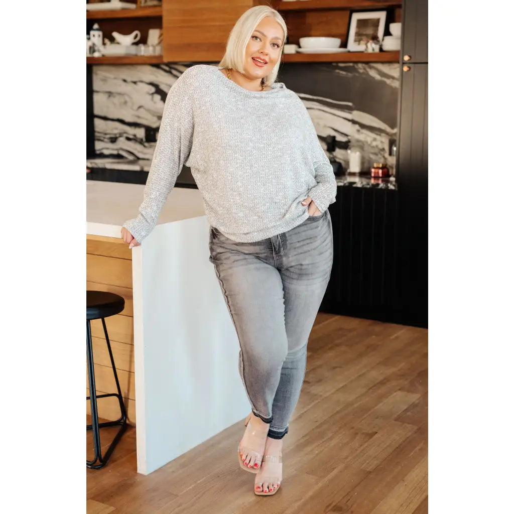 Introducing our Foggy Idea Boatneck Top! Made with light grey lightweight knit this top offers both cozy comfort