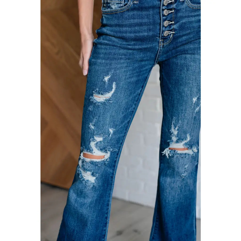 Our Gabriella Distressed Button Fly Flare Jeans by Judy Blue feature a stretch denim that shapes mid-rise and slight