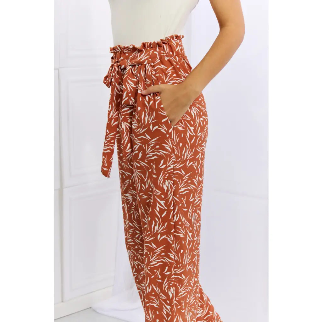 These trendy geometric print paperbag pants are made from a beautifully soft high quality fabric. The elastic waistband