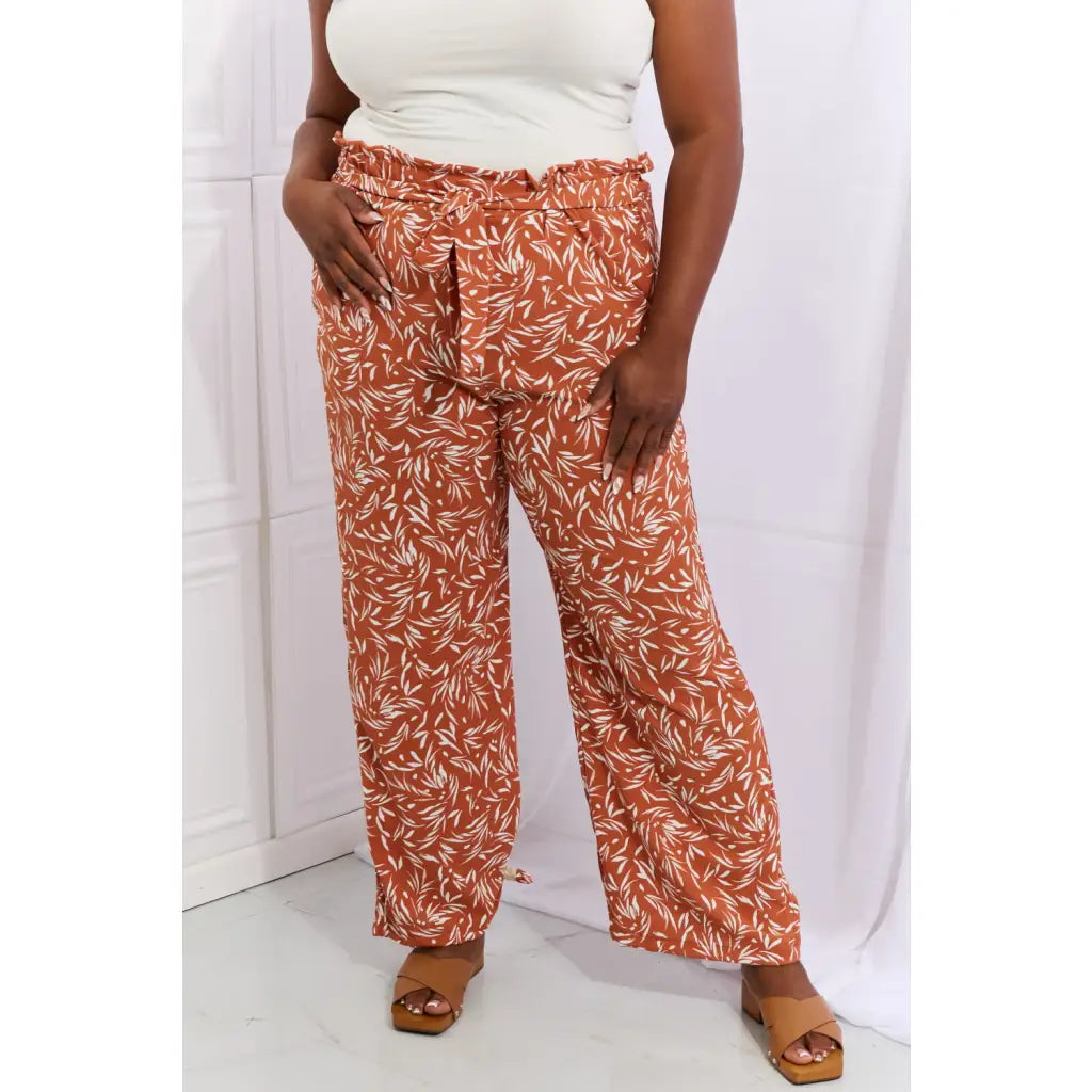 These trendy geometric print paperbag pants are made from a beautifully soft high quality fabric. The elastic waistband